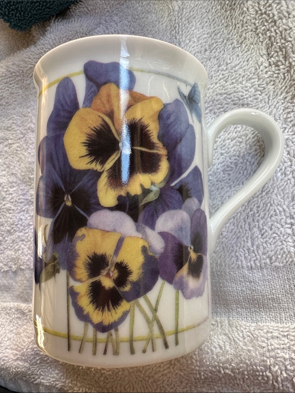Avon Marjolein Bastin small ceramic coffee mug with purple pansies.